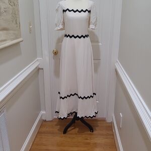 Elegant Cream Midi Dress with Black Trim